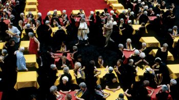 women at gathering to form a quilt formation