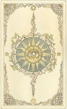 tarot card depicting eye in the middle of a sun